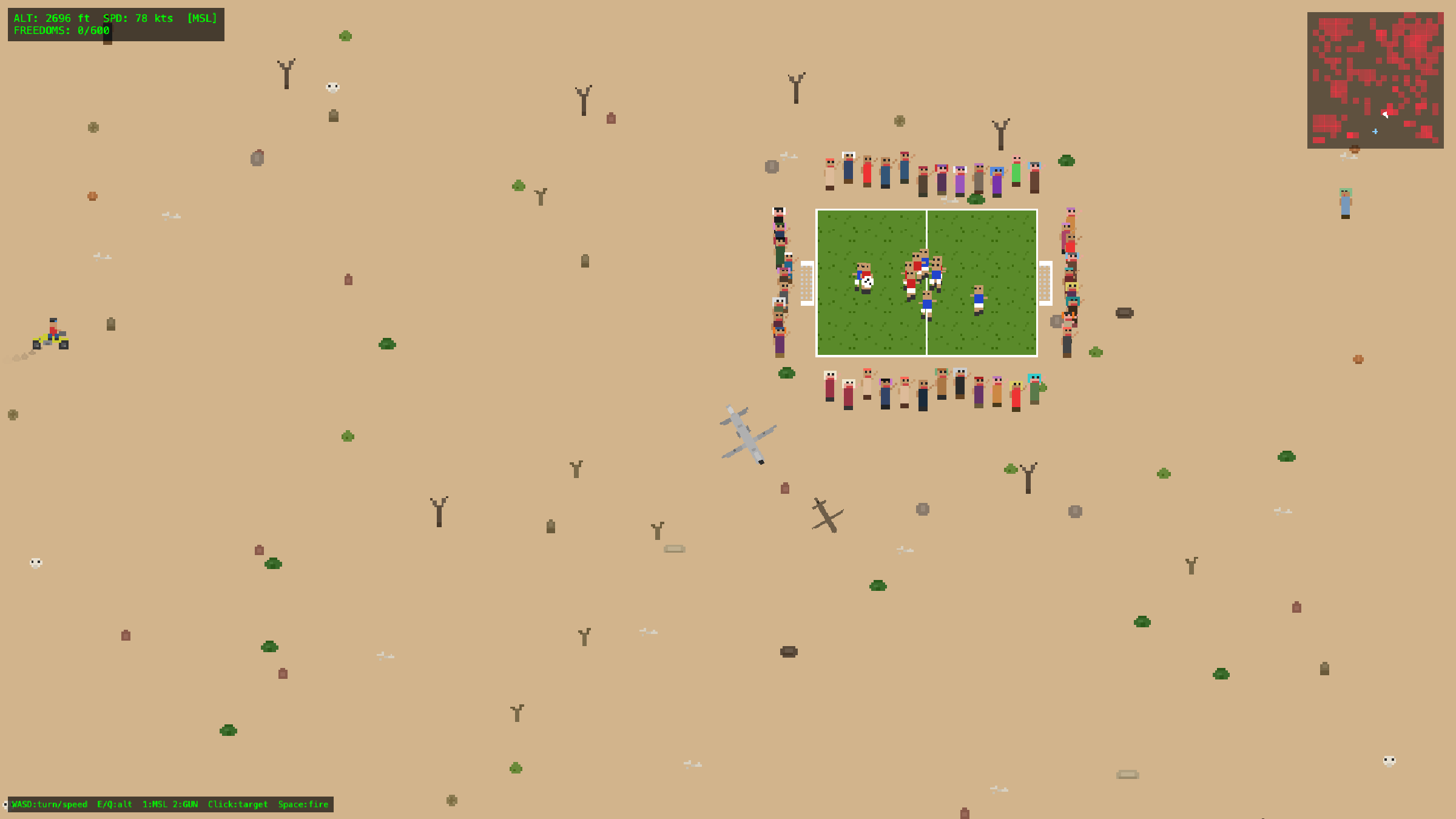 A village soccer pitch ringed by a dense crowd of spectators, with the drone circling overhead